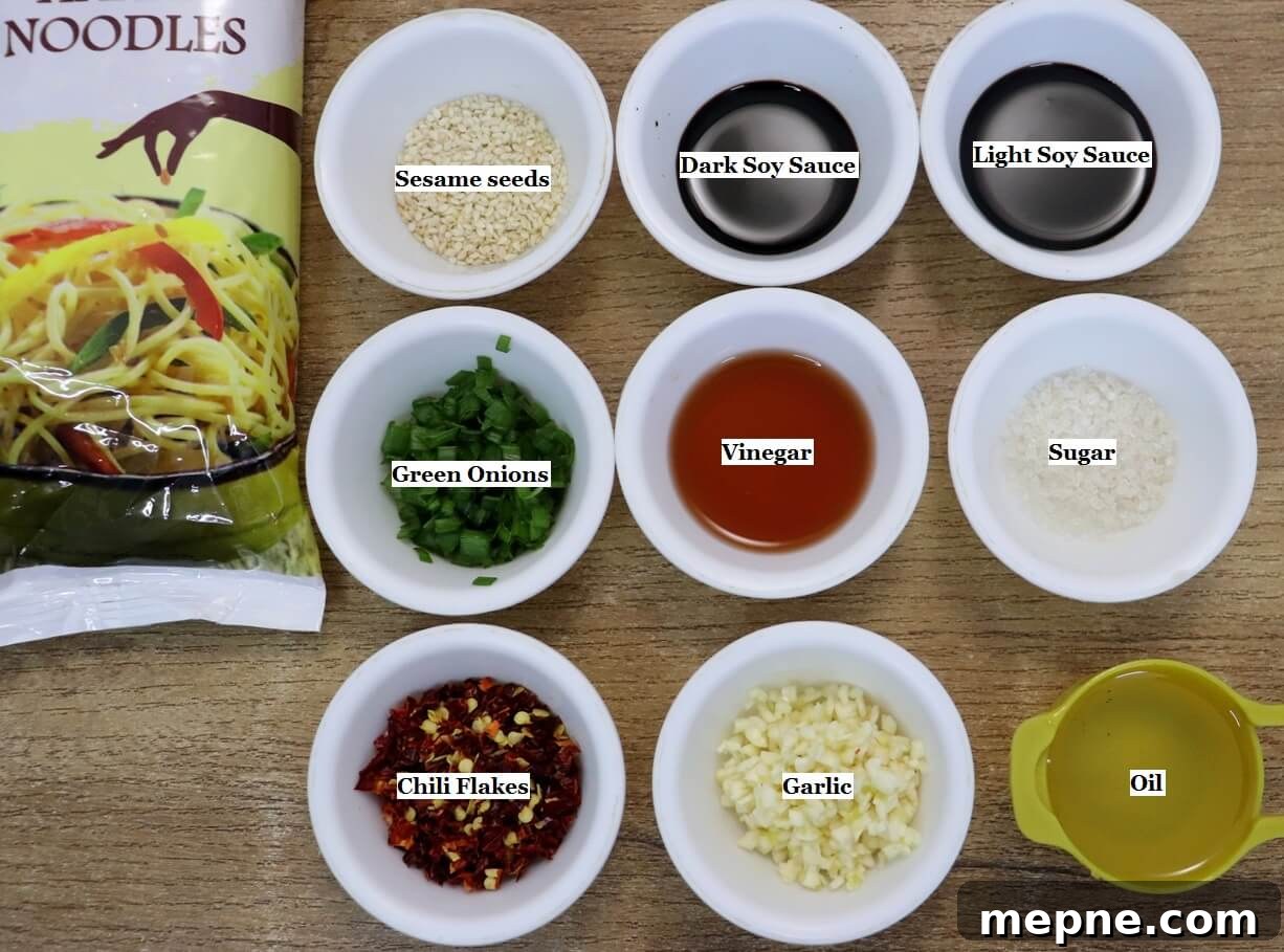 individually labeled ingredients to make garlic chili oil noodles recipe are laid out on a table.