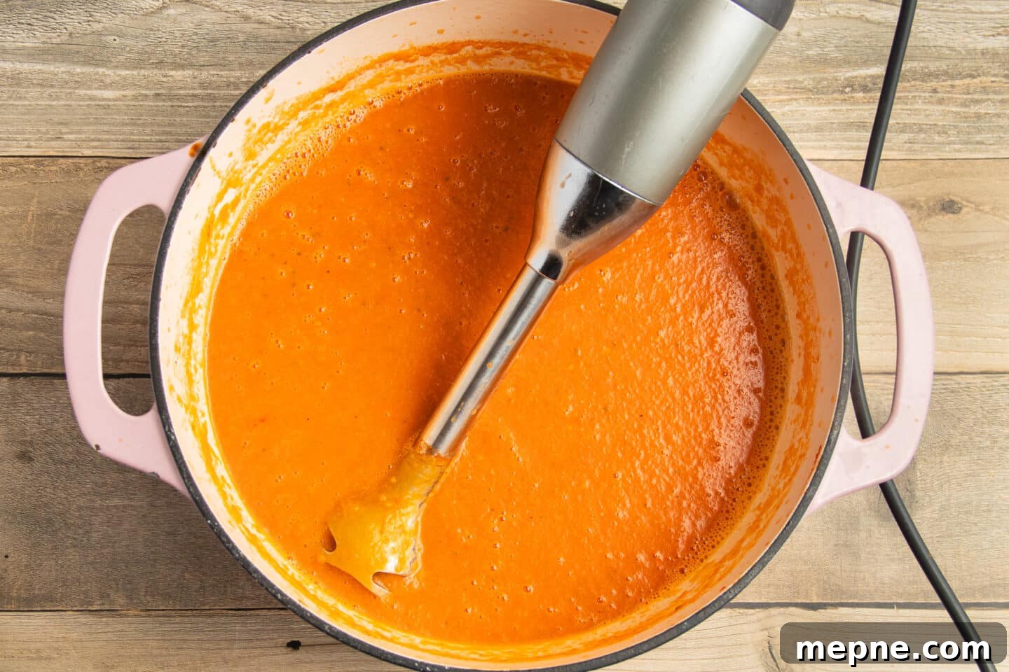 Creamy Roasted Garlic Tomato Soup Recipe 10 This is a picture of the soup being blended.