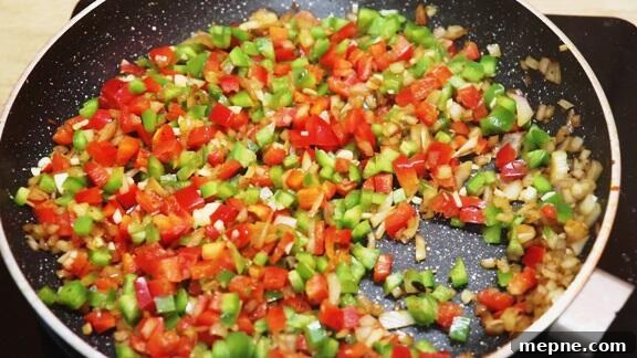 Cajun Chicken and Rice Skillet 5 sauteing vegetables to make one pot chicken and rice.
