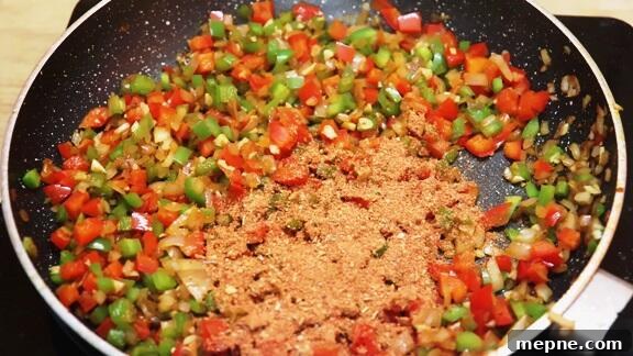 Cajun Chicken and Rice Skillet 6 addition of Cajun seasoning to the sauteed vegetables.
