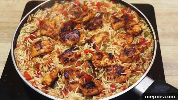 Cajun Chicken and Rice Skillet 9 addition of chicken to the pan.