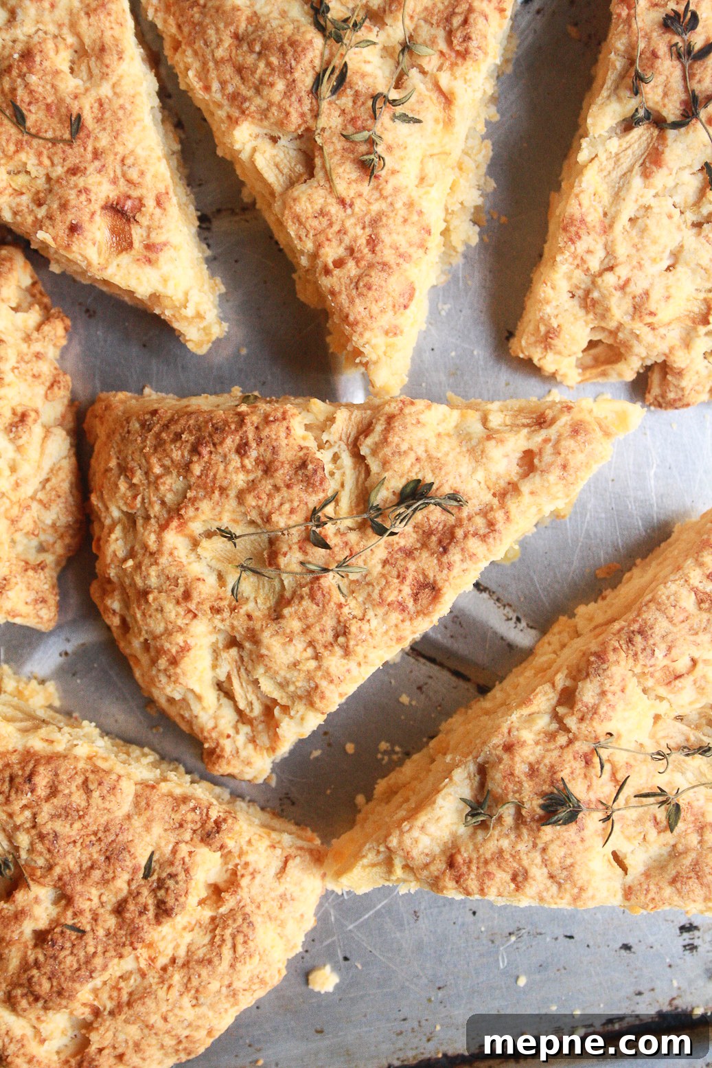 Soft, buttery scones filled with apple chunks, sharp cheddar and a hint of thyme for a savoury kick!