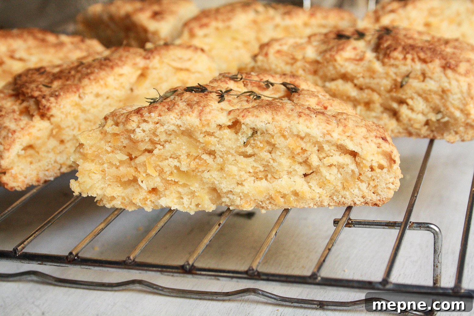 Soft, buttery scones filled with apple chunks, sharp cheddar and a hint of thyme for a savoury kick!