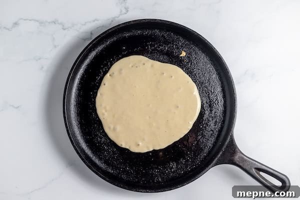How to Make Fluffy Sourdough Pancakes from Your Starter 8 sourdough pancake on griddle