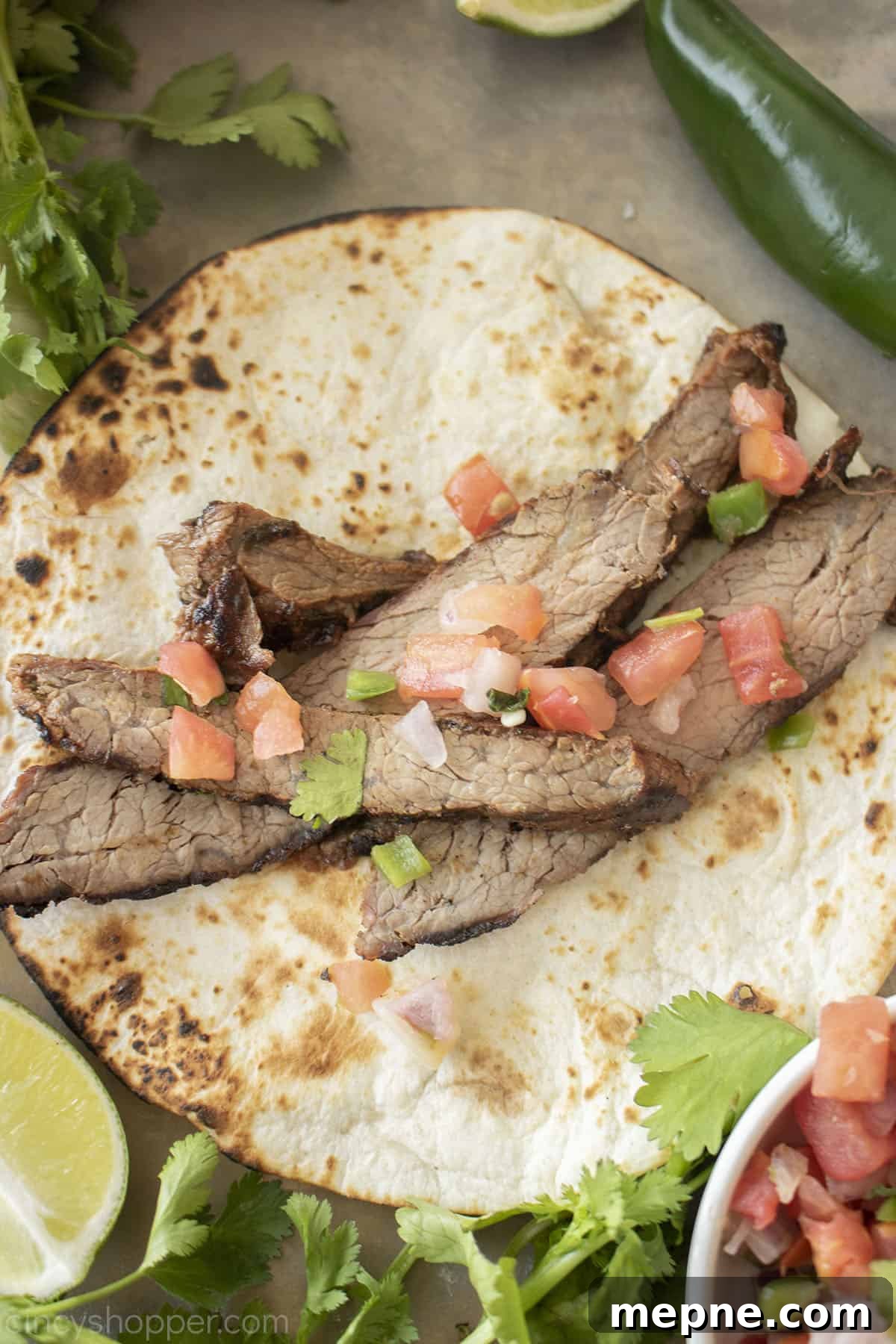 Grilled Carne Asada with Citrus Marinade 2 Grilled Carne Asada on a tortilla.
