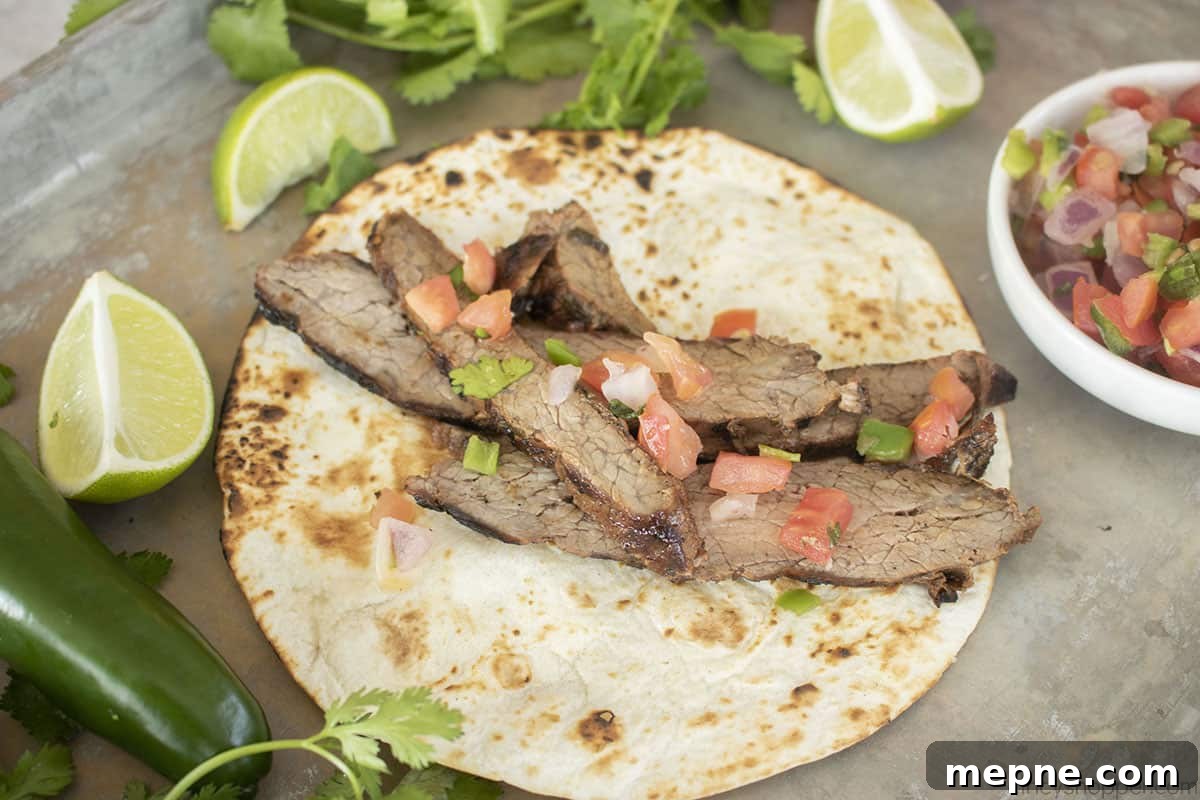 Grilled Carne Asada with Citrus Marinade 6 Carne Asada with pico de gallo on a warm tortilla.