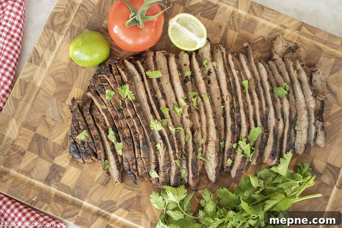 Grilled Carne Asada with Citrus Marinade 7 Grilled flank steak on a cutting board.