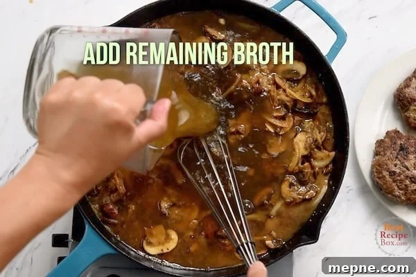 Pouring in remaining broth to the mushrooms and onions