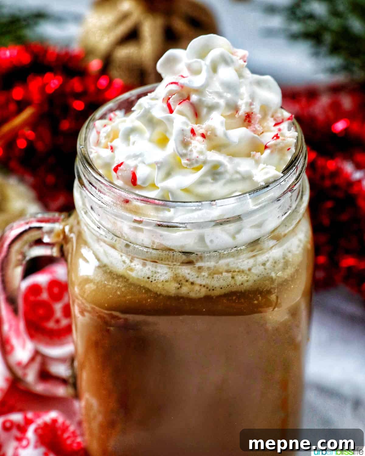 White Chocolate Peppermint Mocha Recipe 2 glass mug of white chocolate peppermint mocha with whipped cream.