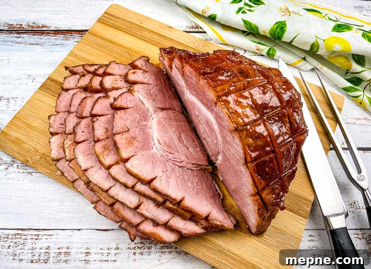 33 BBQ Recipes That Turn Budget Cuts Into Gourmet Meals 19 Smoked sliced ham on a cutting board.
