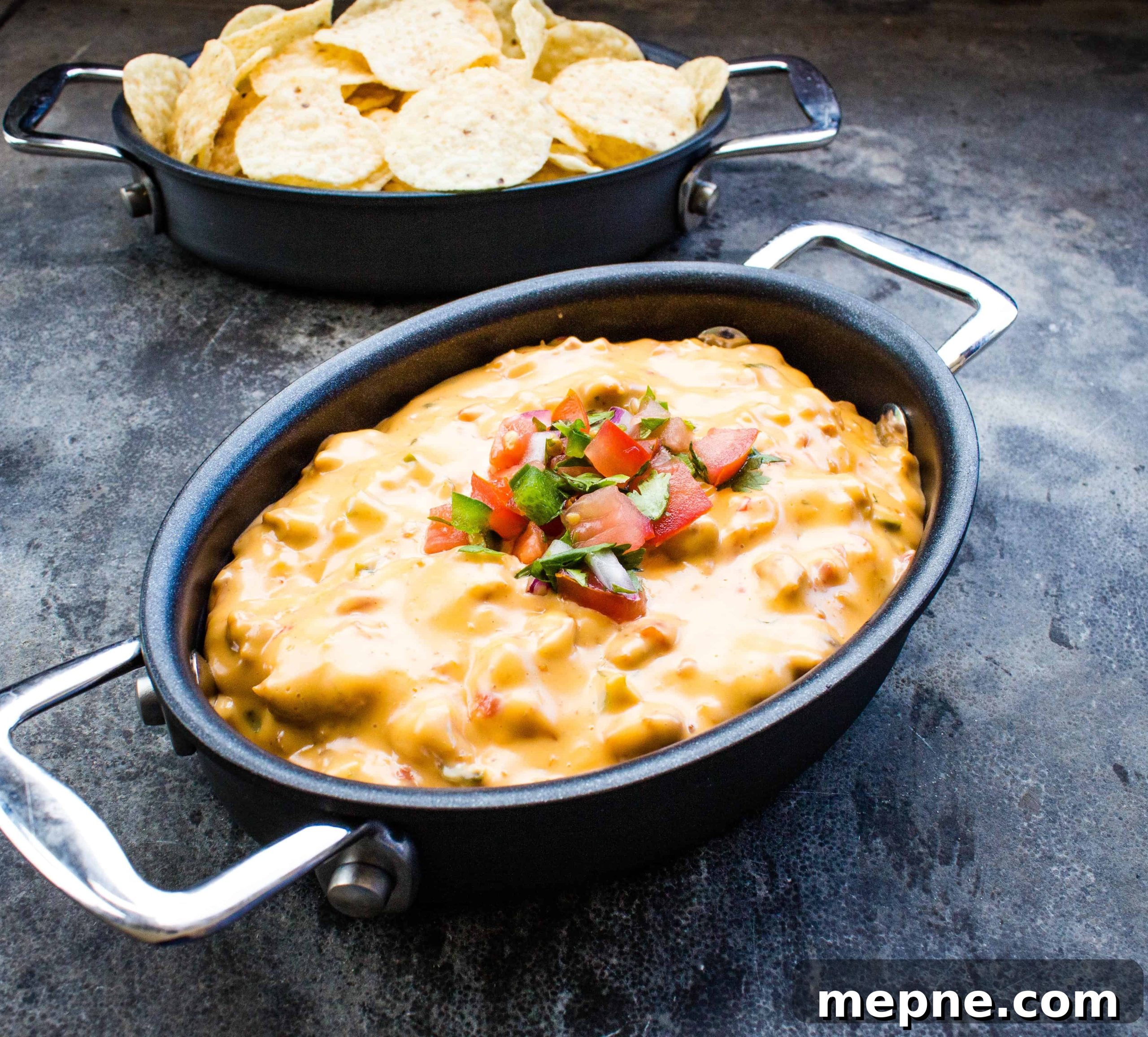 33 BBQ Recipes That Turn Budget Cuts Into Gourmet Meals 35 Smoked queso in a black pot.